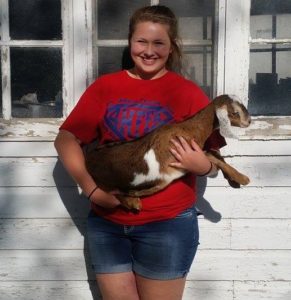 2017 Share-A-Kid winner Kenzie Britten with her nubian doeling from J&J Livestock