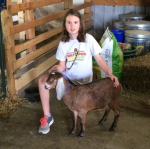 IDGA Share-A-Kid winner with nubian doeling from Ballasalla Nubians